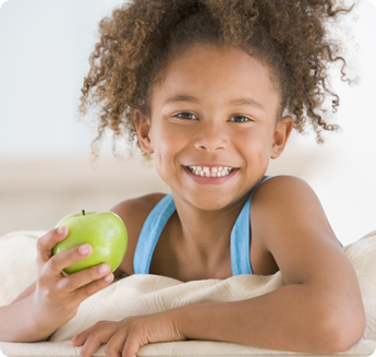 Little Girl Holding an Apple - VPK Jacksonville FL